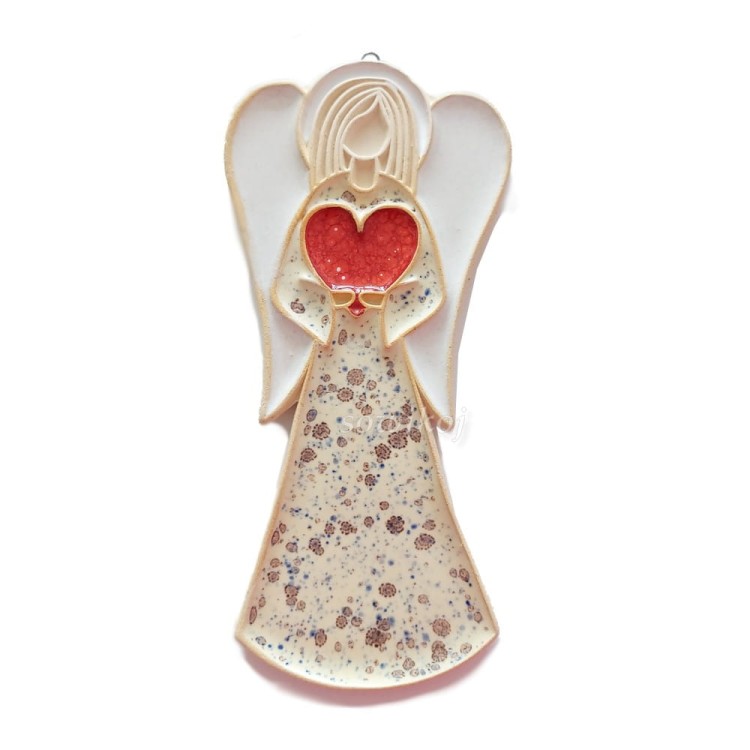 Ceramiczny aniołek średniej wielkości w kolorze ecru.