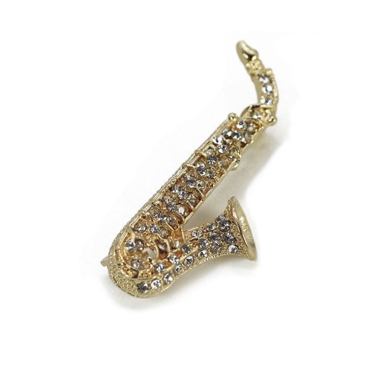 pozłacana broszka saksofon z cyrkoniami