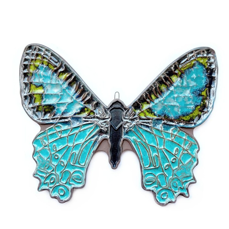 Duży motyl turkusowo zielony