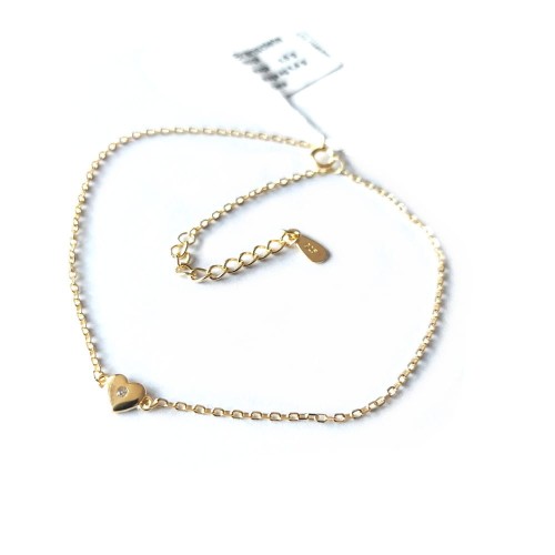 Delikatna bransoletka na nogę - kostkę z dużą regulacją. Serduszko z cyrkonią pośrodku. Srebro 925 pokryte złotem